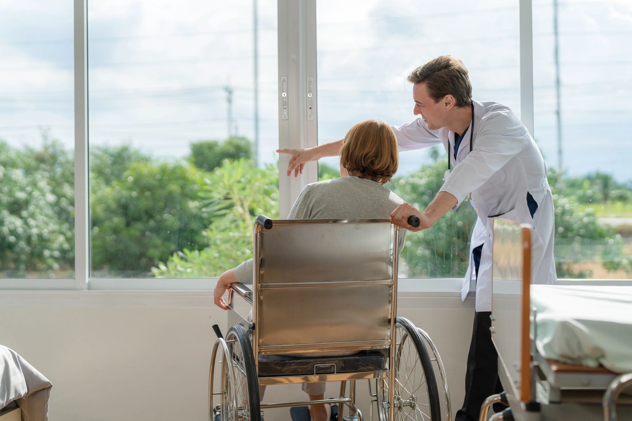 Caregiver supporting a patient during healthcare transportation
