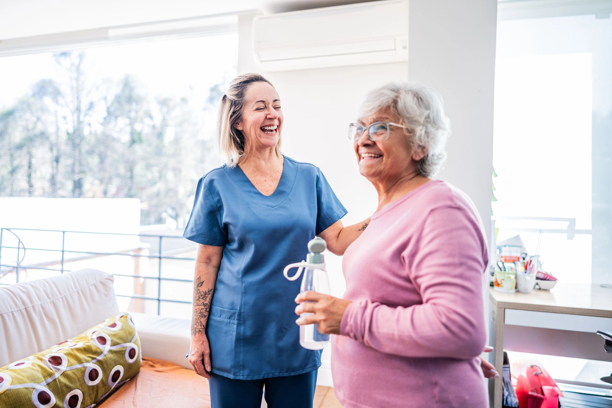 Caregiver supporting a senior patient during recovery