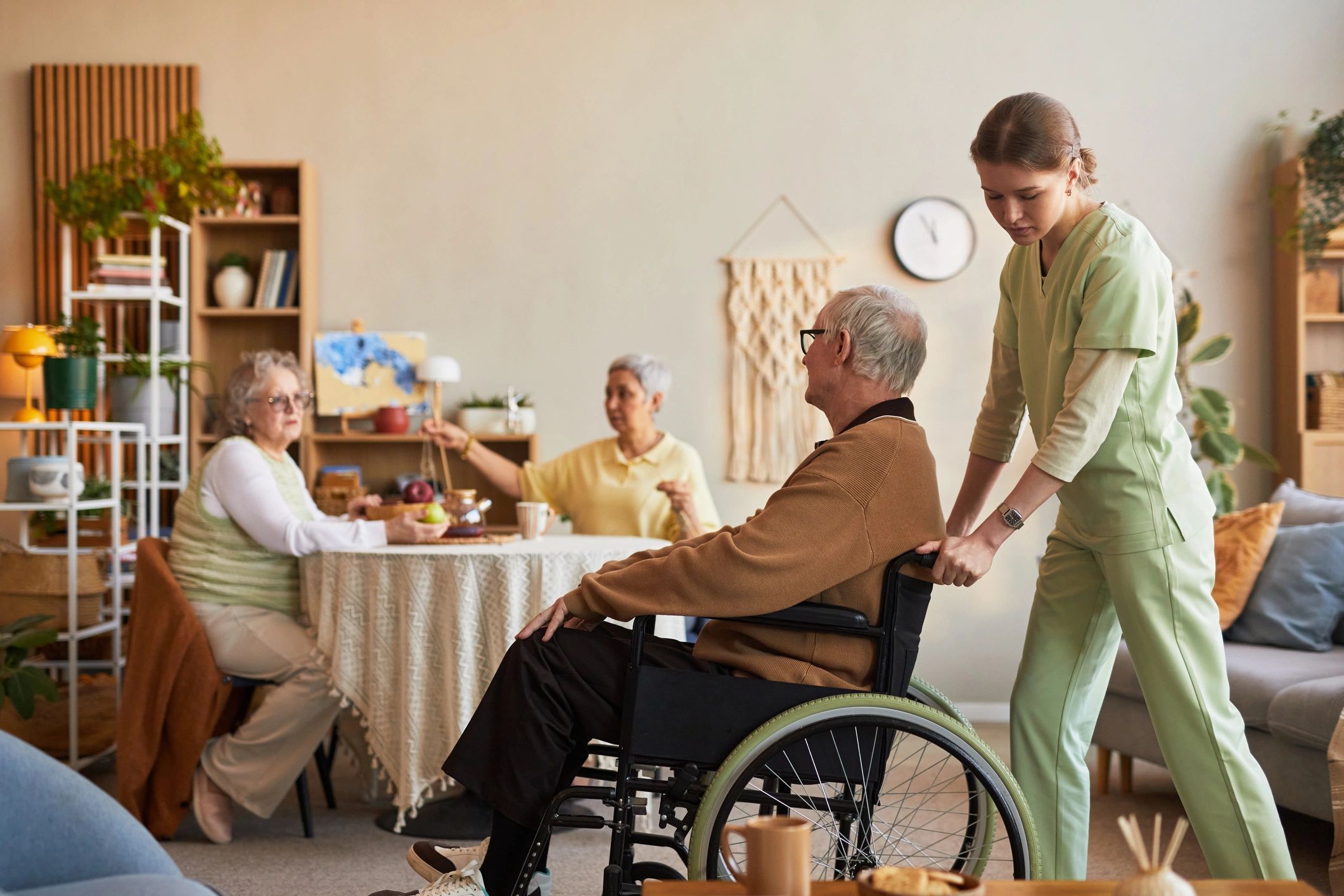Senior man in wheelchair receiving compassionate transport support